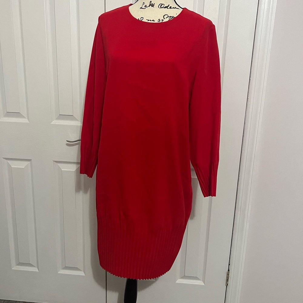 Red knee length dress with pleated hem